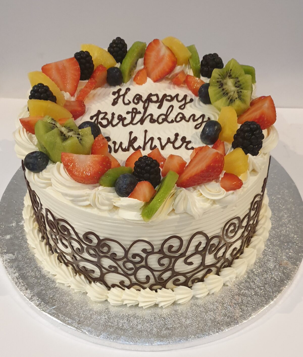 Chocolate Wrapped Fresh Cream Cake With Fruits CB-RC016